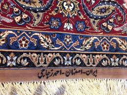 what makes signed persian rugs so