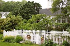 White Picket Fence Around A Raised Bed