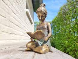 Bronze Sculpture Of A Girl Reading A