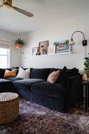 small cozy living room with black sofa