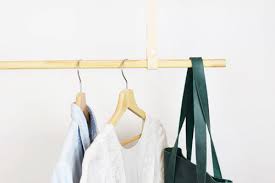 hanging clothes rod from slanted ceiling