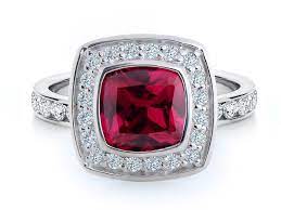 A 1.25ct good colour ruby, claw set, with thirty round cut diamonds set in the surround, totalling.40ct. Lara Ruby Ring Cushion Cut Art Deco Style Brilliant Inc Fine Jewellery