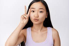 cute asian woman showing kawaii peace