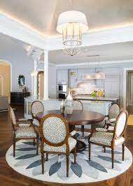You can even layer it on top of another rug. Gray White Dining Room With Floral Accents Eye Catching Chairs Round Table Round Dining Room Round Dining Room Table Dining Room Images