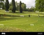 Two men playing Pitch & Putt Golf in the grounds of Woodthorpe ...