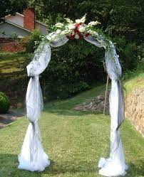 wedding arch with tulle and flowers off