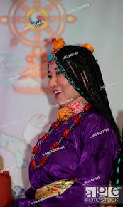 CANADA, TORONTO, 21.06.2015, A Tibetan Khampa woman dressed in a traditional  outfit with turquoise..., Stock Photo, Picture And Rights Managed Image.  Pic. VIG-5487285 | agefotostock