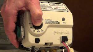 You reset the electric water heater reset button by pushing that red button. How To Light A Water Heater Honeywell Electronic Gas Control Youtube