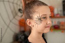 makeup and painted halloween spider web