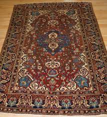 antique isfahan rug with small
