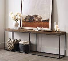 This classic accent table will fit perfectly in any living room. Malcolm 84 Console Table Pottery Barn