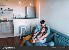 cute couple cuddling while watching