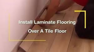 install laminate flooring over a tile