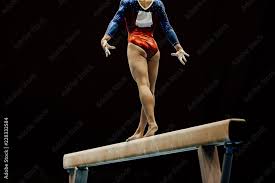 performance female gymnast on balance