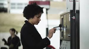 ms woman paying at gas station orem