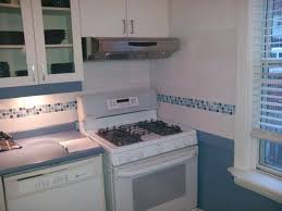 Get the feel of spring all year round with a tiled, painted or glass backsplash in colors from pale celery to deep olive. Kitchen White Kitchen Having White Ceramic Back Splash Using White And Blue Glass Mosaic Til Glass Tiles Kitchen Glass Tile Backsplash Ceramic Tile Backsplash