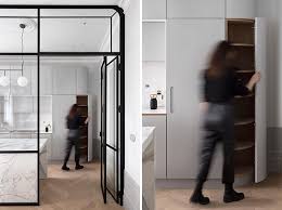 A Black Framed Glass Wall Separates The