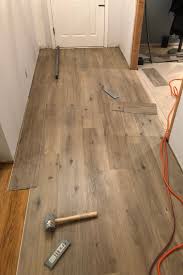 Hold the next plank at a slight angle against the previous plank's end and fold down to click it into place. Easiest Install Diy Vinyl Plank Flooring Vinyl Plank Flooring Diy Flooring Luxury Vinyl Plank Flooring