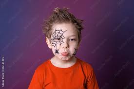 cute little boy with halloween makeup