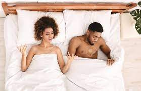 Sex Problem. Upset Black Lovers Lying On Bed, Woman Unsatisfied, Sad Man  Looking Under Blanket, Top View Stock Photo, Picture and Royalty Free  Image. Image 117679271.
