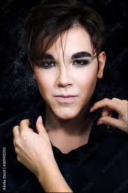 young guy with black bright makeup