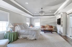 master bedroom with tray ceiling