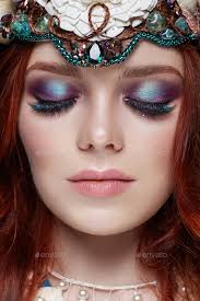 redhead with bright makeup and big