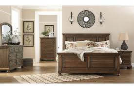 Made with acacia veneers/engineered board and hardwood solids with a rich light brown burnished finish. Flynnter Queen Panel Bed Ashley Furniture Homestore