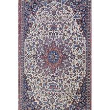 a signed cream ground isfahan rug with