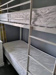 white metal shorty bunk beds with