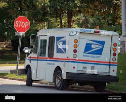 A United States Postal Service Grumman LLV mail delivery truck parks along a residential street on Wednesday, Sept. 29, 2021 in Frankfort, Franklin County, KY, USA. USPS is implementing new service standards