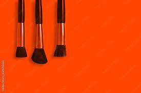 orange makeup brushes stock photo