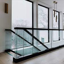 Morse industries glass and metal handrail system components are designed for use with 1/2 or 3/4 tempered or laminated glass panels as structural balusters. Glass Railing For A Modern Residential Space Glass Staircase Railing Glass Railing Concrete Interiors