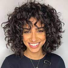 (we don't want to bring up any bad memories involving wet curls shrinking into a style you weren't cool talk to your hairstylist while your hair is dry and curly because the shape of curls will be obvious. 23 Pretty Spring Haircuts To Freshen Up Your Look Medium Curly Hair Styles Curly Hair With Bangs Curly Hair Styles
