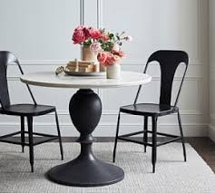 If you want to make a bold presentation during a party, consider pairing a dark marble tabletop with bright colored dinnerware tempered by simple placemats or charger plates. Buy Chapman Marble Dining Table Online Pottery Barn Uae