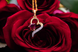 shaped necklace on red roses
