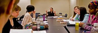 Associate Professor Liz Powell works with a student in her Creative Writing  class  La Sierra University