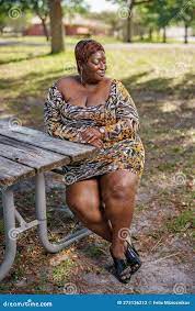 BBW Big Black Beautiful Model Sitting on a Park Bench Outdoors Stock Photo  - Image of hair, overweight: 273136212