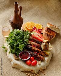 lula kebab on a board with pita bread