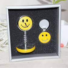 yellow smiley spring clock with smiley