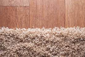 install wood flooring over carpet