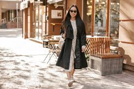 Long Haired Woman In Black Trench Coat