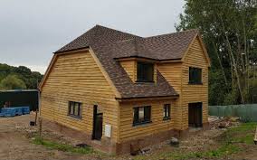 oak frame building clad in sips jml