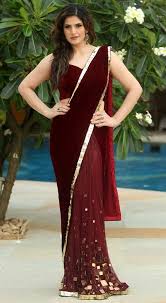 Check out the beautiful bollywood actresses in wonderful sarees! Fashion Sweet Pink Zarin Khan In Designer Maroon Saree Pics Velvet Saree Maroon Saree Saree Designs