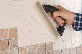 put tiles over painted concrete walls