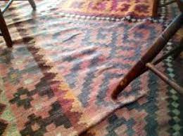 wrinkles out of an area rug