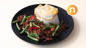 The king of street food in thailand is called phat kaphroa, and it's made with your choice of meet (pork, chicken, beef, or seafood), stir fried with thai holy basil and garlic, and served with rice and a fried egg. Pad Kra Pao Gai Thai Minced Meat With Basil Nyonya Cooking Youtube