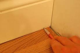 installing baseboard with coped cuts at