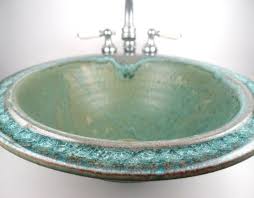 sea green ceramic sink with fused glass