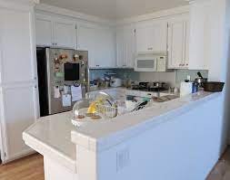 We are asked all the time, should you add a clear coat to your kitchen painted kitchen cabinets? Kitchen Cabinet Repaint With Cabinet Coat